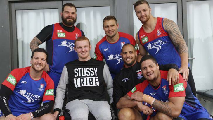 Special guest: Alex McKinnon dropped in at Newcastle Knights training on Saturday, pictured with (back) Adam Cuthbertson, Robbie Rochow, Korbin Sims, (front) Jarrod Mullen, Jeremy Smith and Willie Mason. Photo: NRL
