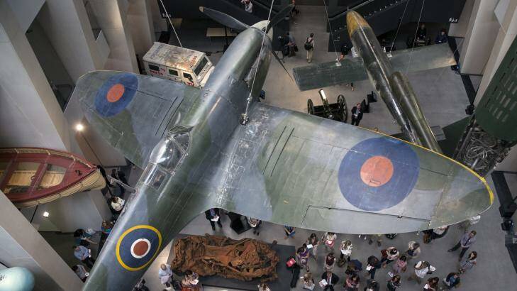 The main atrium at the Imperial War Museum  displays a Spitfire and a V2 rocket. Photo: Getty Images/Oli Scarff