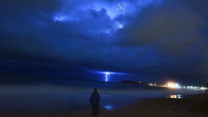 The storm moves out to sea on Monday night, as seen from Narrabeen. Photo: Nick Moir