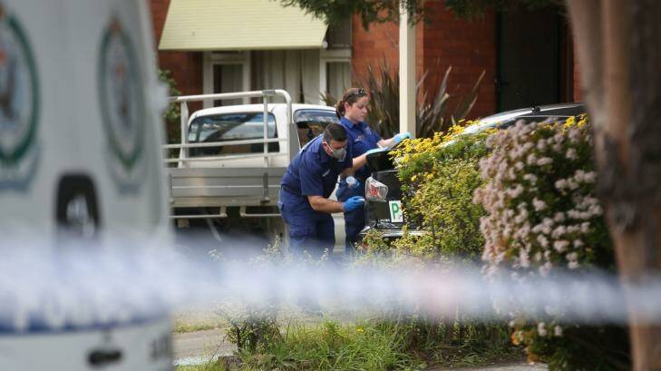 Police and forensic investigators survey the scene following the death in Panania. Photo: James Alcock/Fairfax Media