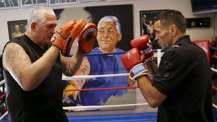 Mick Gatto spars with three-times world champion Anthony Mundine in Gatto's home gym last year. Photo: Paul Jeffers