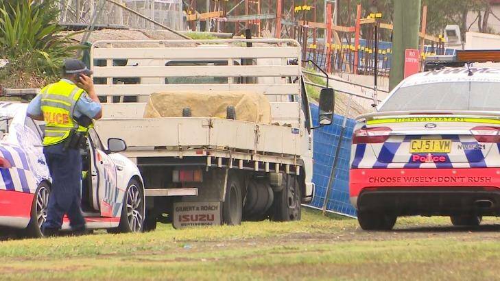 The scene where a truck driver who was pulled over by police on a road in Sydney's west got out of his rig only to be hit and killed by a semi-trailer. Photo: TNV screengrab