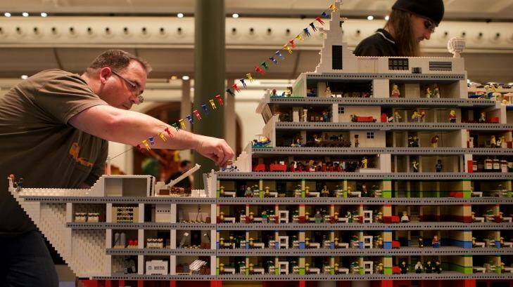Professional Lego builder Ryan McNaught (left) and workers set up for the Lego exhibition at the Town Hall, Sydney.
25th June 2015
Photo: Wolter Peeters
The Sydney Morning Herald Photo: Wolter Peeters, Wolter Peeters W