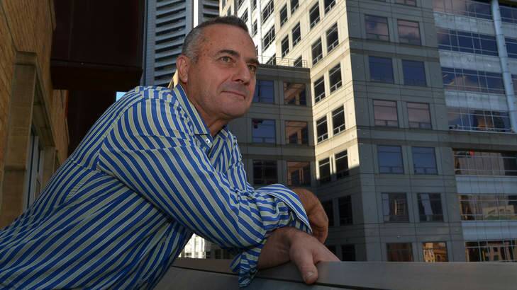 John Del'Amico on the balcony of his inner-city apartment. Photo: Michael Clayton-Jones