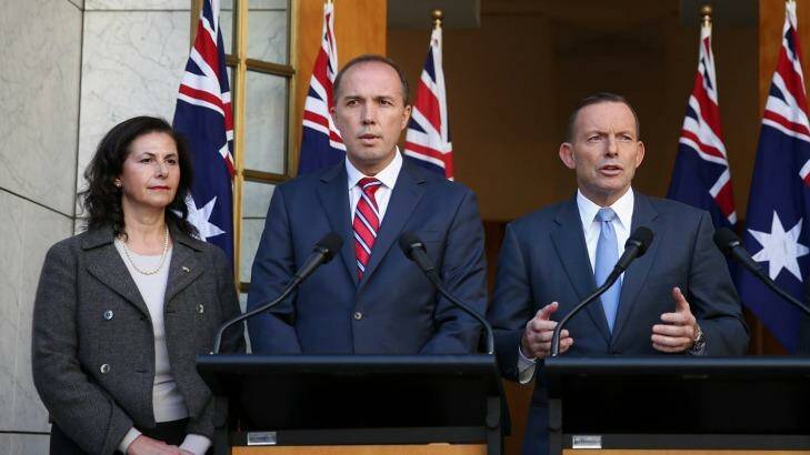 Senator Concetta Fierravanti-Wells, pictured with Immigration Minister Peter Dutton, and former prime minister Tony Abbott, has distanced herself from the rhetoric of Mr Abbott.  Photo: Alex Ellinghausen