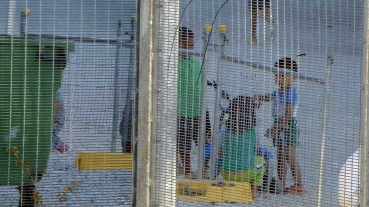 An Amnesty International photograph of children playing near the refugee processing centre on Nauru. Photo: Amnesty International