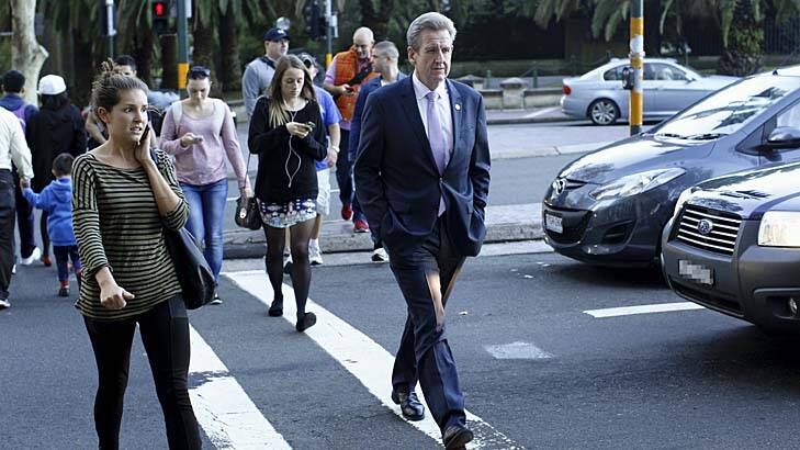 Now just a man on the street: Barry O'Farrell walks across Macquarie Street. Photo: James Brickwood