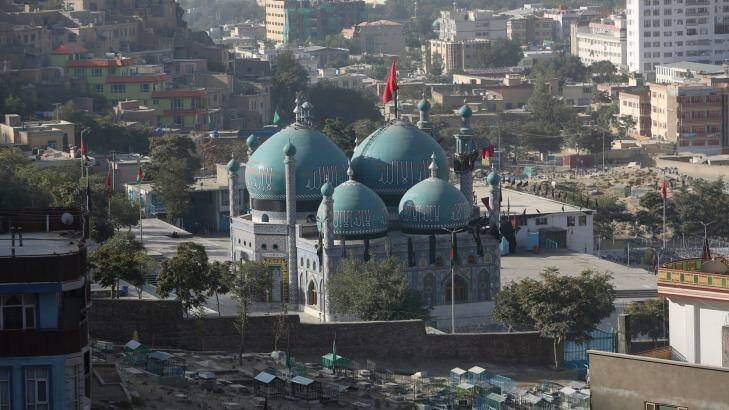 Flags fly on Kart-e-Sakhi shrine in Kabul, Afghanistan. Photo: Rahmat Gul