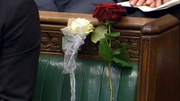 A white and red rose where Jo Cox should have been sitting in parliament.  Photo: PA