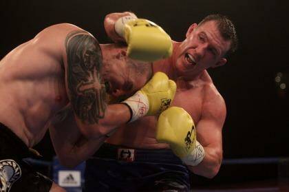 On the way up: Paul Gallen  subdues Randell Ray on Saturday night. Photo: Chris Lane