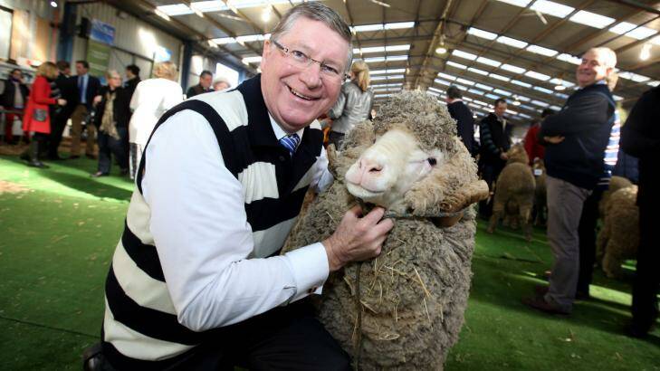 Jolly jumbucks: Premier Denis Napthine, in his woollen Geelong jumper, at Sheepvention in Hamilton last week. Photo: Damian White