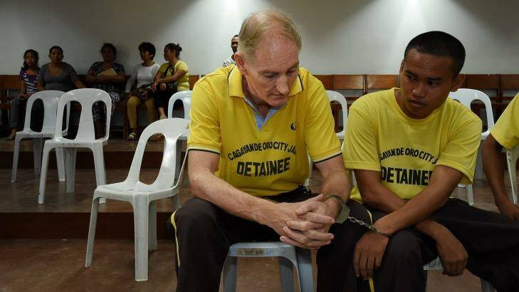 Peter Scully inside the Cagayan De Oro court handcuffed to another inmate on his first day of his trial. Photo: Kate Geraghty