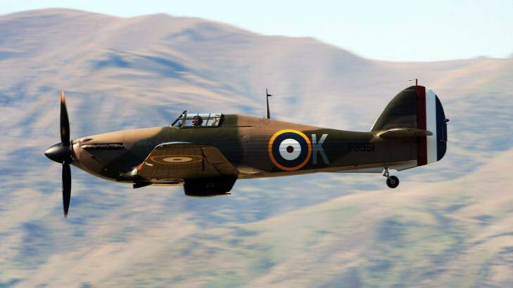 A WWII Hawker Hurricane fighter takes part in a mock battle during a Warbirds Over Wanaka airshow. Photo: Ross Land