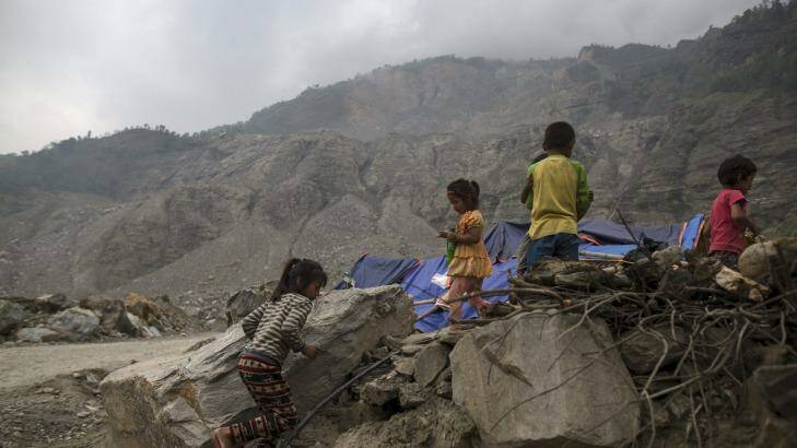 Children next to their makeshift shelter near a landslide area after the earthquake at Jure village in Sindhupalchowk, Nepal. Photo: Athit Perawongmetha