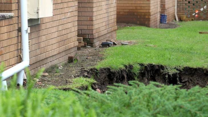 Two sink holes were pumped with concrete on Monday night in a bid to prevent them expanding. 

 Photo: Isabella Lettini