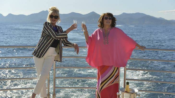 Patsy (Joanna Lumley) and Edina (Jennifer Saunders) in their element chugging champagne, in a scene from the new 20th Century Fox film. Photo: David Appleby