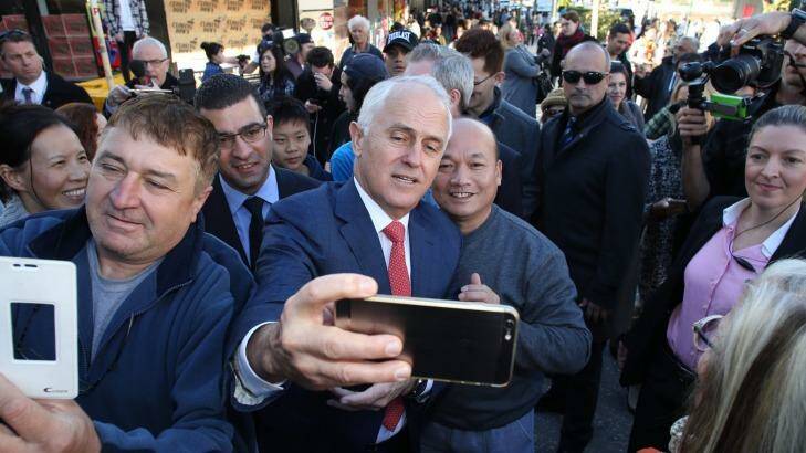 Mr Turnbull takes one of many selfies at Hurstville station in Sydney on Wednesday. Photo: Andrew Meares