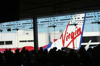 The deal frees funds to expand the airline's frequent flyer program, Virgin says. Analysts believe the money will be needed to fund operating losses after Virgin took full control of Tigerair. Photo: Peter Braig