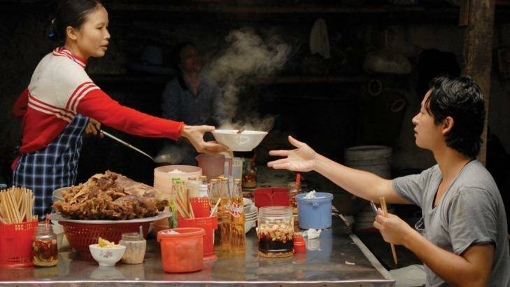 APT ambassador to Asia Luke Nguyen samples food from a street kitchen.