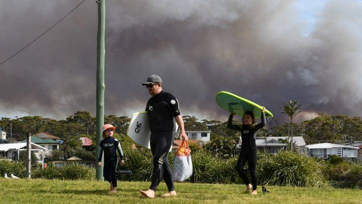 Smoke rises from a fire on the Beecroft Peninsula in Jervis Bay, as seen from Currarong. Photo: Peter Rae