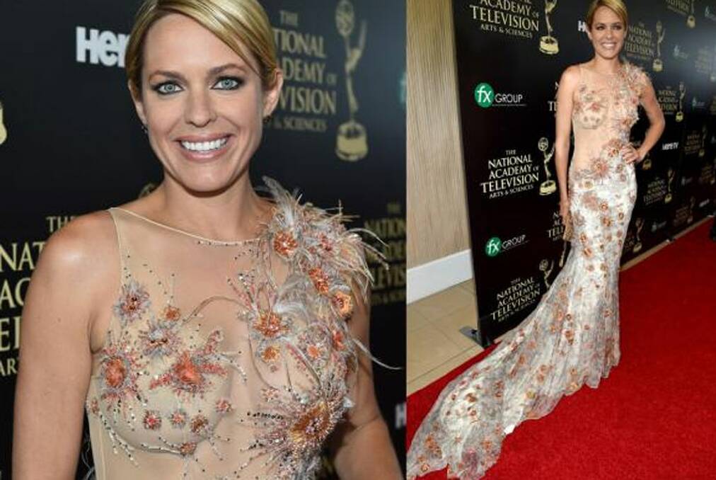 THE BAD: It's unfortunate that they've chosen the colour of pus for the details on Arianne Zucker's dress: it's like she's just popped a couple of boils en route. Or perhaps she's in the middle of some sort of Minority Report metallic spider takeover and is just smiling through it like a pro? 'These pesky dystopic arachnids certainly aren't going to ruin my big night gosh-darn-it!'. (PS: For all of you who like to limit their TV watching to post-the-6-o-clock-news, Zucker's from Days Of Our Lives).