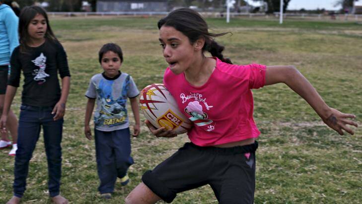 Boots and all: League and soccer are the sports of choice in Wilcannia. Photo: Brendan Esposito