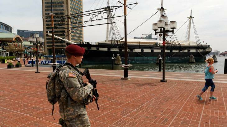 A National Guard trooper patrols Baltimore's harbour area. Photo: Trevor Collens