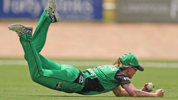 Meg Lanning takes a spectacular diving catch to dismiss Rachael Haynes of the Thunder during a Women's Big Bash League match. Photo: Scott Barbour