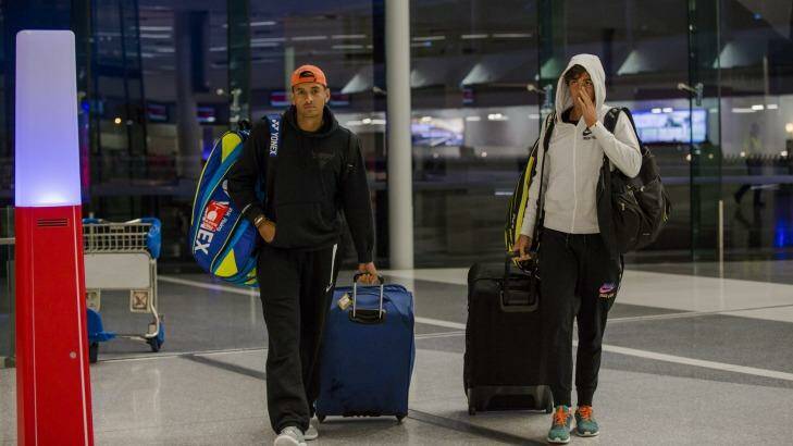 Plenty of baggage: Nick Kyrgios and Thanasi Kokkinakis arriving at Canberra airport in July. Photo: Jamila Toderas