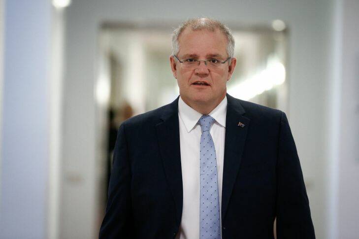 Treasurer Scott Morrison arrives in the press gallery for an interview, at Parliament House in Canberra on Monday 27 March 2017. fedpol Photo: Alex Ellinghausen
