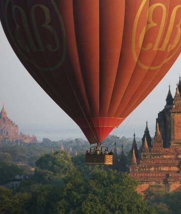 Hot air balloons fly over Bagan.
