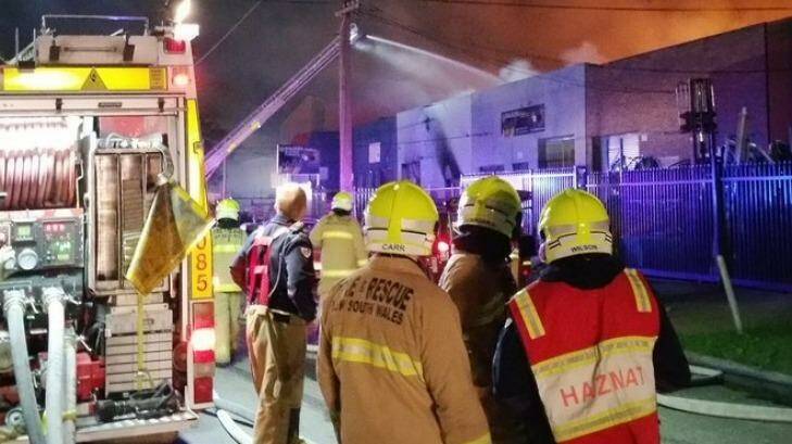 Firefighters tackle a factory blaze in Greenacre. Photo: Twitter/Fire and Rescue NSW