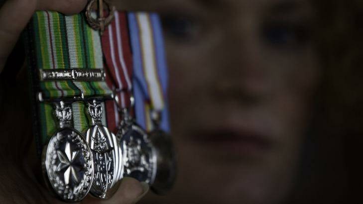Bridget Clinch pictured in 2010 with the medals she was awarded for two tours of duty in East Timor. Photo: Heather Faulkner