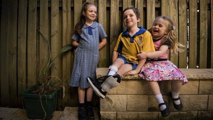 On a mission: Year 3 student Cormac Ryan with his sisters Tilly, 7, and Hannah, 3, at home in Sydney. Photo: Kate Geraghty