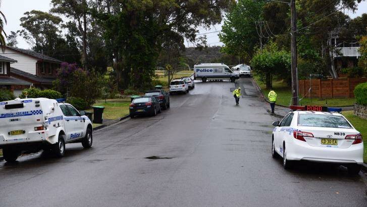 Police at a crime scene on Sir Thomas Mitchell Drive in Davidson where a family of four have been found dead in their home  Photo: Wolter Peeters