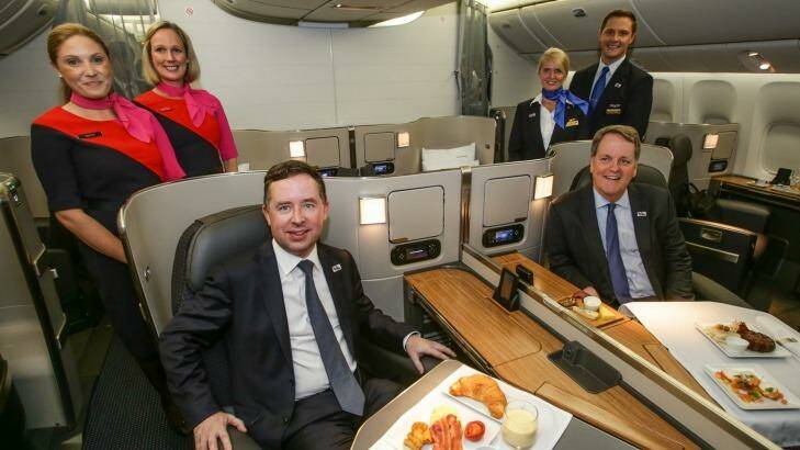 Alan Joyce, left, and Doug Parker in the first-class cabin of one of the US airline's Boeing 777 aircraft that will fly daily into Sydney from December 19.  Photo: Dallas Kilponen