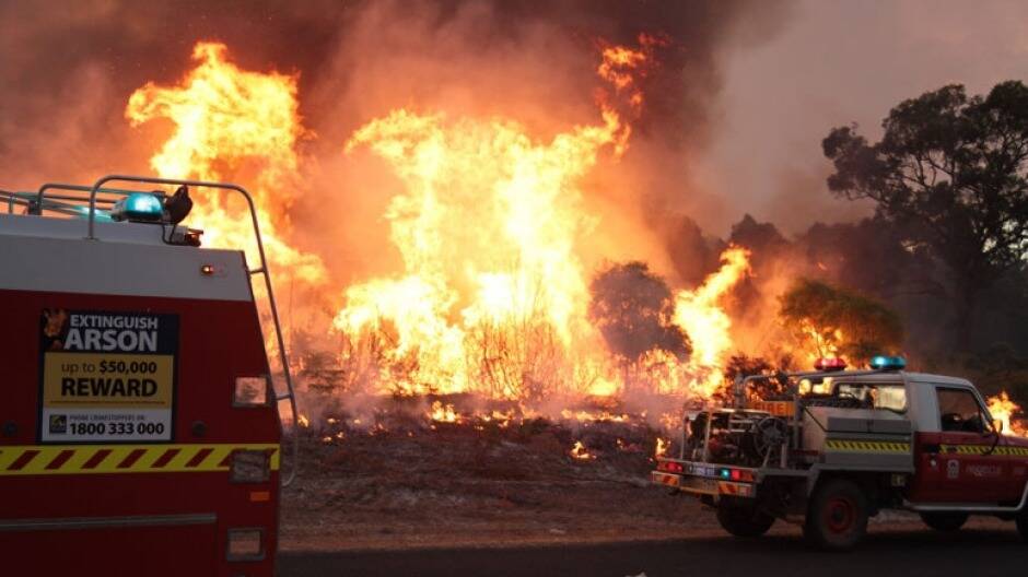 The Department of Fire and Emergency Services has captured some amazing images of firefighters tackling the massive blaze confronting Northcliffe in WA. Photo: Department of Fire and Emergency Services