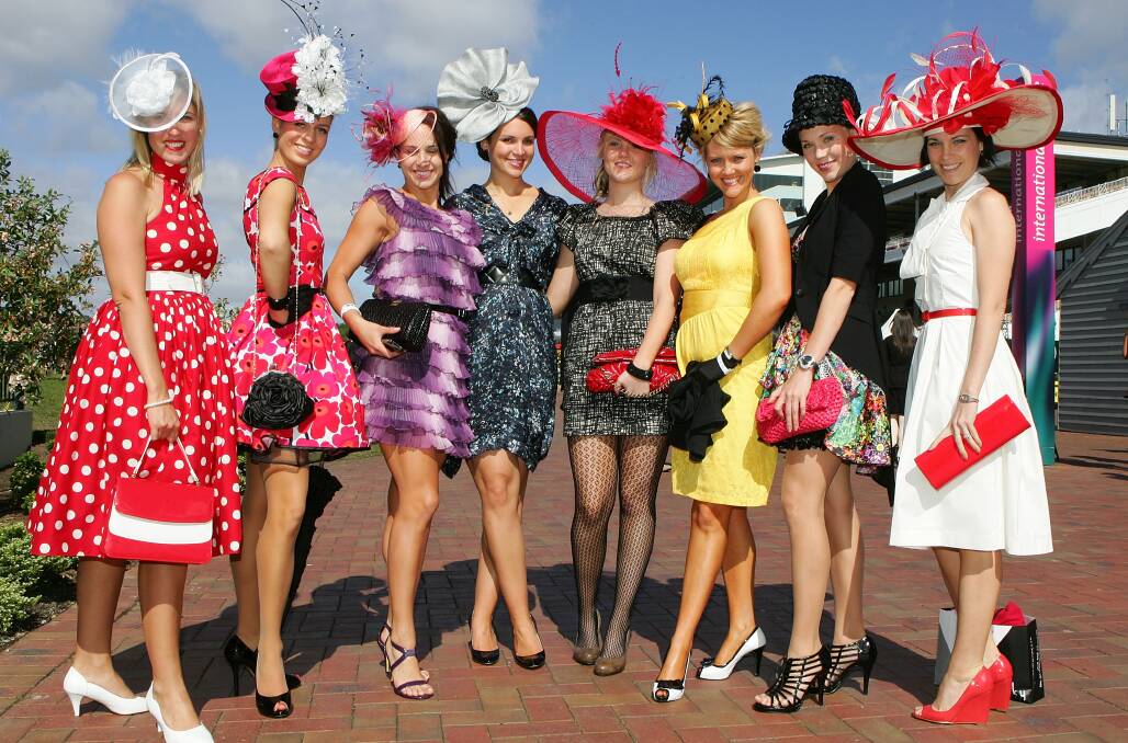 Ladies pose as they arrive to attend the 2009 Melbourne Cup Day meeting at Flemington Racecourse. Getty Images.