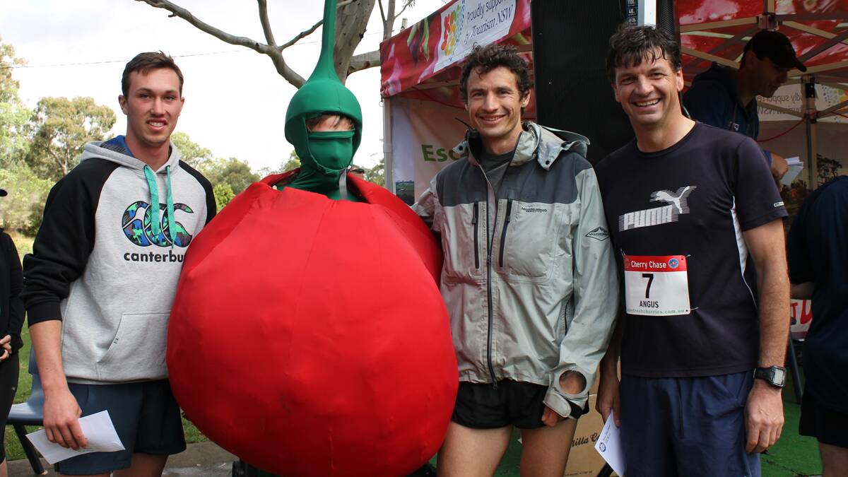 PLACINGS: The first three placings for the men’s 10km Cherry Chase were Brad Hetharia in first place with a time of 35:14, Jacob Tiernan in second with 37:52 and Federal Member for Hume Angus Taylor in third with 40:06. They are pictured with Pip The Cherry. (sub)