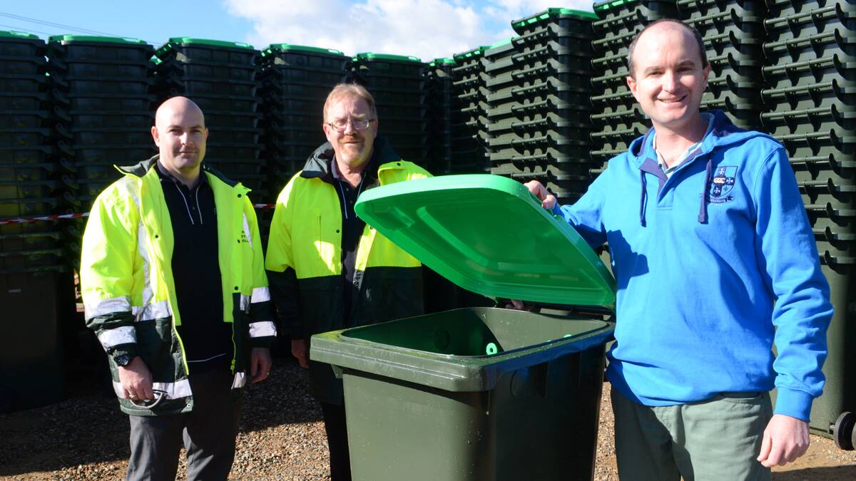 PREPARED: Excited for the rollout of the new green waste bins ahead of the town’s first green waste kerbside collection on June 15 were council’s manager of public health and waste management Matthew Carlin, planning and environment director Craig Filmer and deputy mayor Ben Cooper.                                                                                                     (greenwastebins1-6)