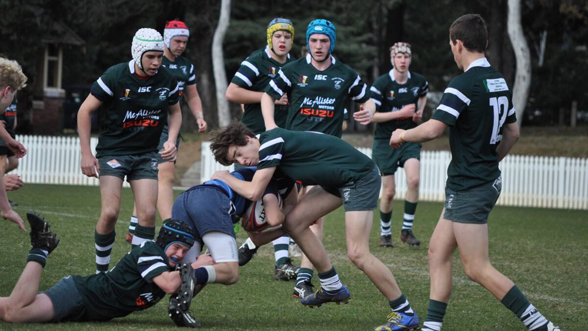 Daniel Parker and Ben Davis combined tackle in the Under 16s Young Yabbies versus Canberra Grammar match on Saturday.