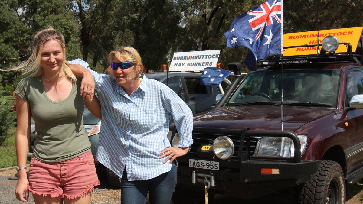 HELPING HAND: Ashliegh and Megan Heritage prepare to embark on the latest Burrumbuttock Hay Run. Two cars from Wallendbeen will assist as escort vehicles. Picture: H Vesey