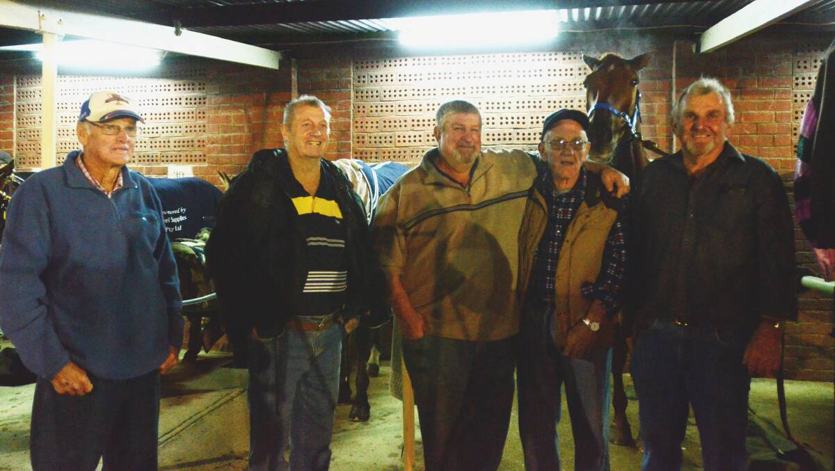 Brian Thornhill, Robert Newham, Darryl Fliedner, Graham Hunt and Col Fliedner in the stables at Saturday night’s meeting. 			     (harness145 (3))