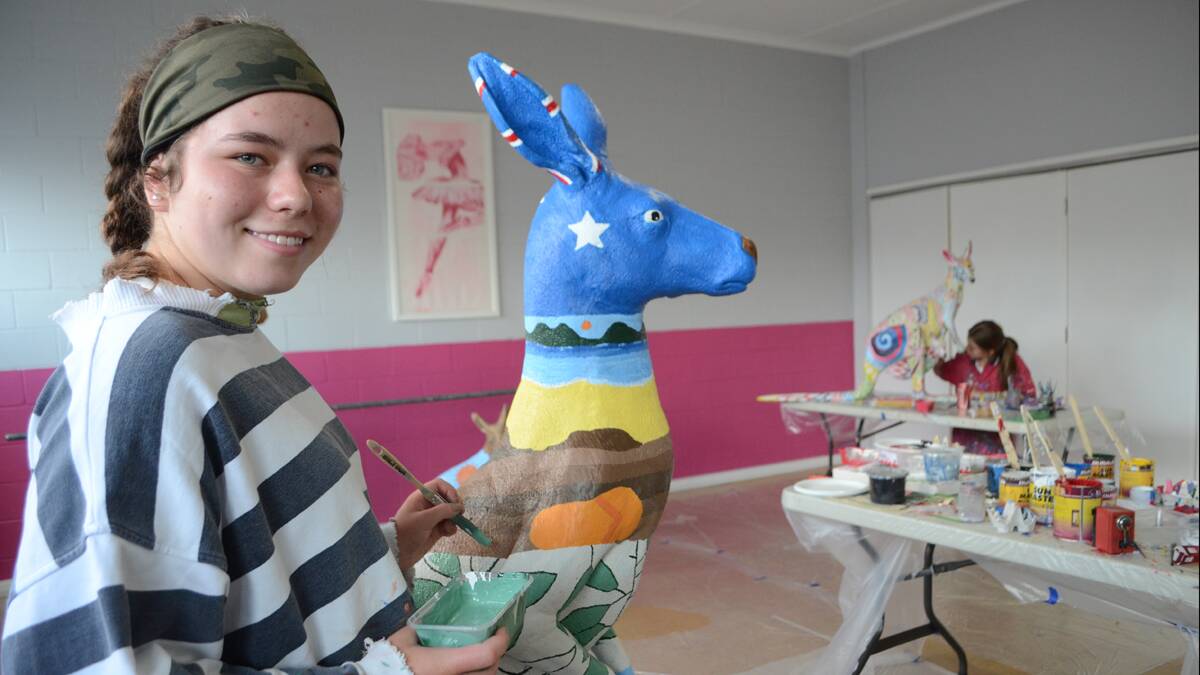 STROKE OF THE BRUSH: Fourteen-year-olds Maddie Smith and Marylouise Minehan were among the six finalists in the Young Youth Council’s Paint-a-Roo competition who were given the opportunity to convey their designs onto lifesize kangaroo moulds for public exhibition.      	           (paintaroo6)