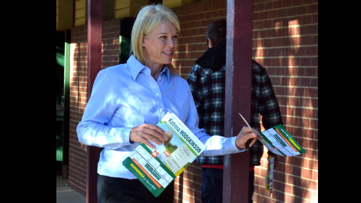 RECORD: Katrina Hodgkinson hard at work at one of the polling booths on Saturday. 
