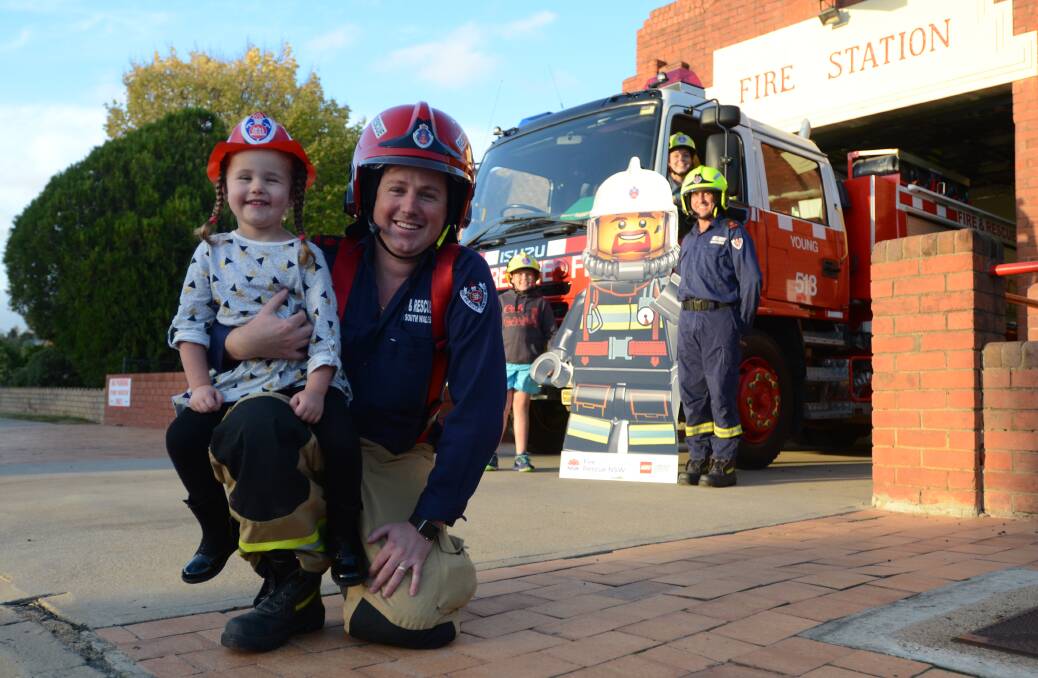 OPEN DAY: Young Fire and Rescue captain Ryan Terry with daughter, Alyssa (4) and (back) deputy captain Dick Donges with his children Jack and Lucy. 													(firiesopenday4)