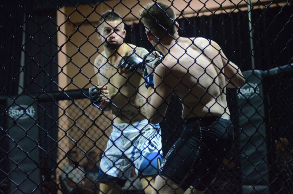 CAGED FIGHT: Young’s Tiger Butt is pictured in action on Saturday night.		   Photo: Tessa Bailey.