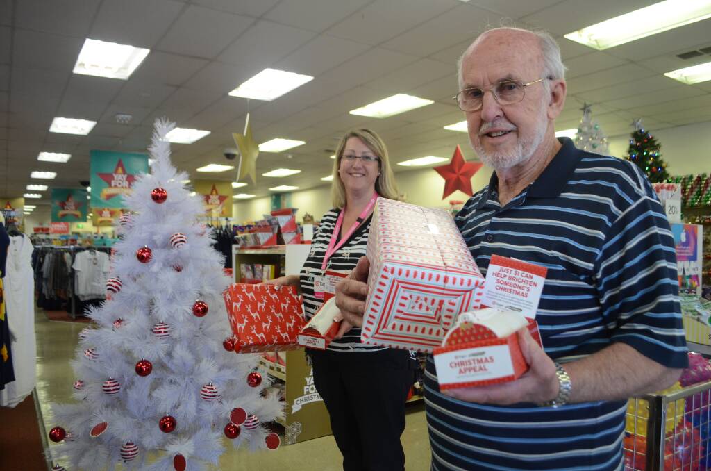 APPEAL: Young Target store manager Tereasa George and local coordinator of this year's UnitingCare Christmas Appeal Bob Lloyd.         (christmasappeal (4))