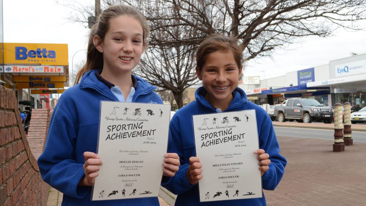 CERTIFICATES: Mollie Hogan and Mili Felix-Vonarx proudly pictured with their Young Sports Advisory Committee sports awards recognising their achievements in soccer.         (milimolly 002)