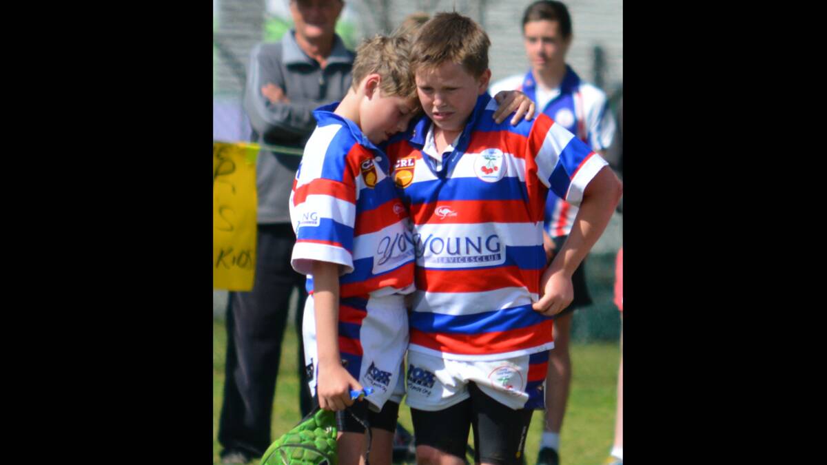 TEAM SPIRIT: The Under 11s team spirit was captured in this single shot showing Duke Maloney offering upset front rower Will Steed comfort after being injured early in the game and not having the chance to play a big part.     (sub)